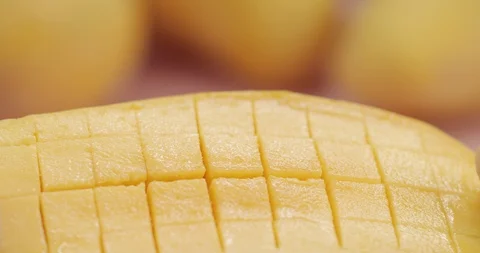Macro shot of man opens mango cut into cubes. 4K Slow Motion Stock Footage 125067036
