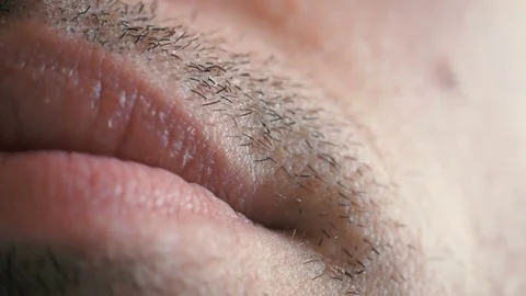 Macro shot of a man smiling and his large mouth Stock Footage 74136443