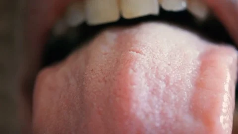 Macro shot of a man sticking out his tongue Stock-Footage 74136406