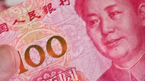 Macro shot of man's hands and Chinese Yuan (CNY) banknotes. Stock Footage 304456311