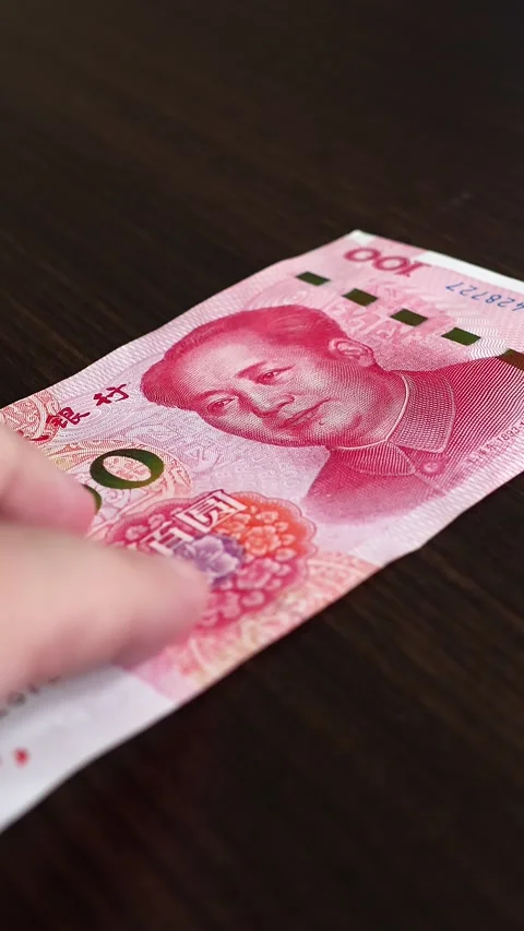 Macro shot of man's hands and Chinese Yuan (CNY) banknotes. Stock Footage 304497140