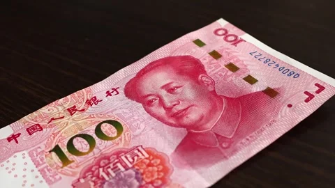 Macro shot of man's hands and Chinese Yuan (CNY) banknotes. Stock Footage 304497595