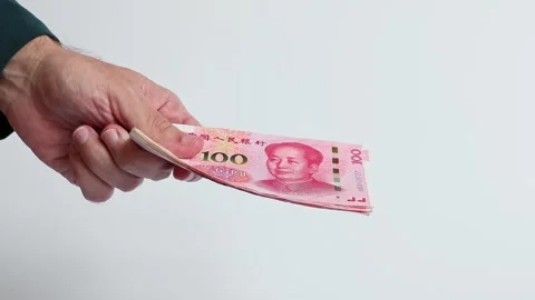Macro shot of man's hands and Chinese Yuan (CNY) banknotes. Stock Footage 305872284