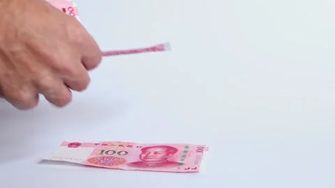 Macro shot of man's hands and Chinese Yuan (CNY) banknotes. Stock Footage 305872635