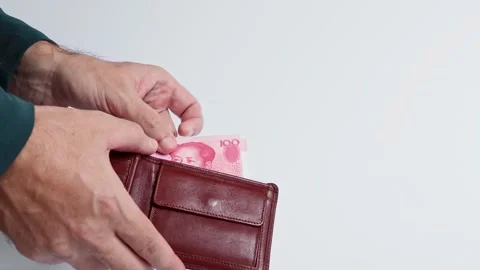 Macro shot of man's hands and Chinese Yuan (CNY) banknotes. Stock Footage 305873332