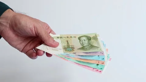 Macro shot of man's hands and Chinese Yuan (CNY) banknotes. Stock Footage 305876705