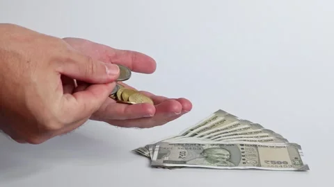 Macro shot of man's hands and Indian rupee (INR) banknotes. Stock Footage 306110895