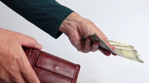 Macro shot of man's hands and Indian rupee (INR) banknotes. Stock Footage 306111007