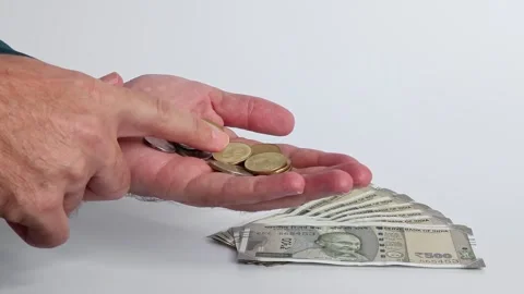 Macro shot of man's hands and Indian rupee (INR) banknotes. Stock Footage 306111225