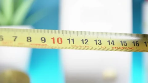 Macro shot of a measuring taper being pulled out revealing many different scales Stock Footage 299675207