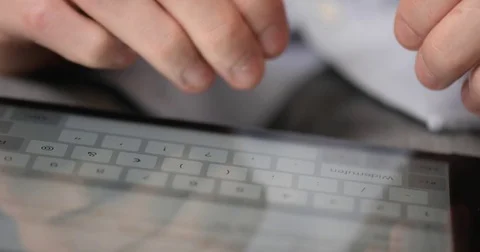 Macro Shot of Mens Hands typing on Tablet PC Stock Footage 85329575
