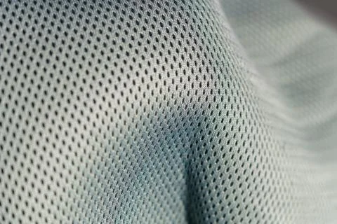 Macro shot of a mesh-like undulating gray silver surface Stock Illustration