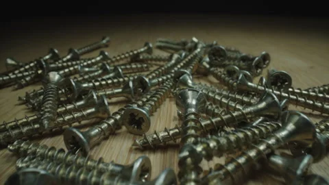 Macro Shot of Metal Screws with Sharp Threads and Textured Heads Stock Footage 338016450