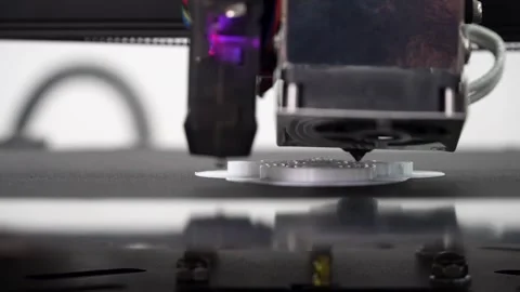Macro Shot of a Modern 3D Printer Making a White 3D Model 库存影片 252884265