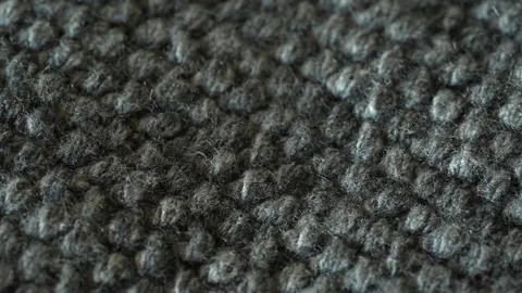 Macro shot with movement of dark grey knitted fabric, extreme close up of cloth Stock Footage 244488765