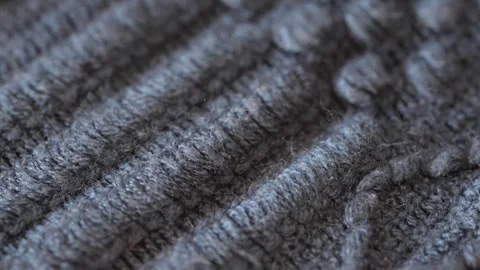 Macro shot with movement of grey knitted fabric, extreme close up of cloth Stock Footage 244227218