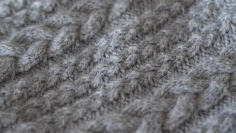 Macro shot with movement of grey knitted fabric, extreme close up of cloth Stock Footage 244487362