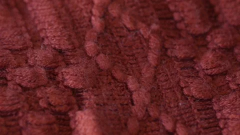 Macro shot with movement of red knitted fabric, extreme close up of cloth Stock Footage 244134949