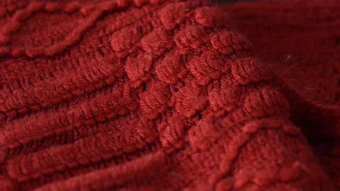 Macro shot with movement of red knitted fabric, extreme close up of cloth Stock Footage 244135067