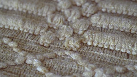 Macro shot with movement of yellow knitted fabric, extreme close up of cloth Stock-Footage 244488697