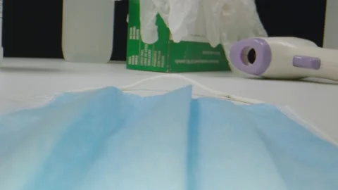 Macro shot moving away from protective gear and sanitizers Stock Footage 130417253