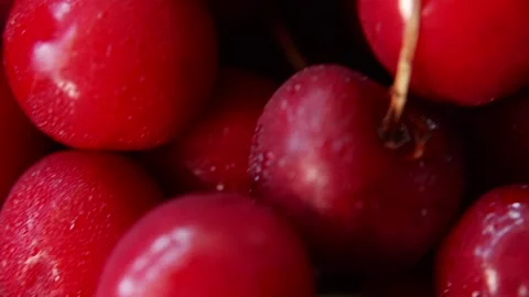 Macro shot of moving sweet cherries showing detailed skin texture Stock Footage 338395445