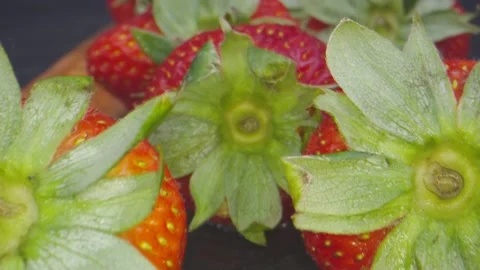 Macro shot moving in through group of strawberries Stock Footage 131689586