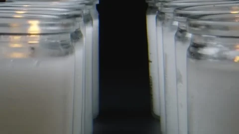 Macro shot moving through row of white candles Stock Footage 132211899