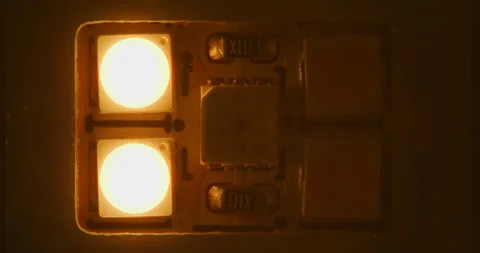 Macro shot of multicolored RGB diode blinking lights. LED colored dots led light Stock Footage 248610313