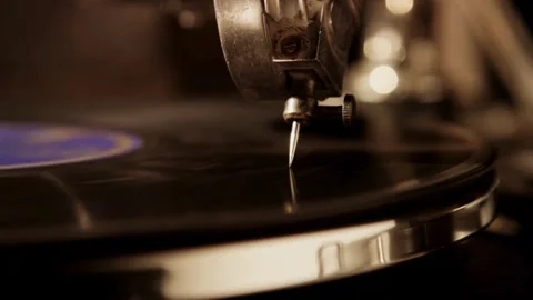 Macro shot of needle on spinning black vinyl record Stock Footage 329559762