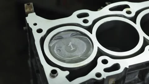 Macro shot of new metal piston inside engine cylinder block Stock Footage 340273581