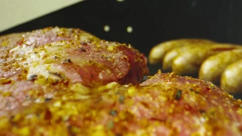 Macro shot of oil being spread over beautiful ribs on a bbq grill Stock Footage 131689500