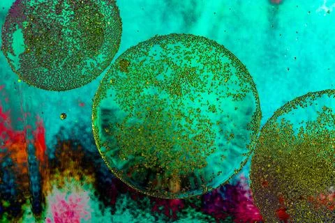 Macro shot of oil bubbles over colored background Stock Illustration