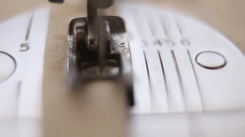 A macro shot from an old sewing machine working on a piece of cloth in southeast Stock Footage 264528416