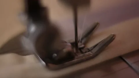 A macro shot from an old sewing machine working on a piece of cloth in southeast Stock Footage 264528435
