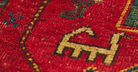Macro shot of an old shabby handmade carpet made by Samarkand masters using Stock Footage 256649440