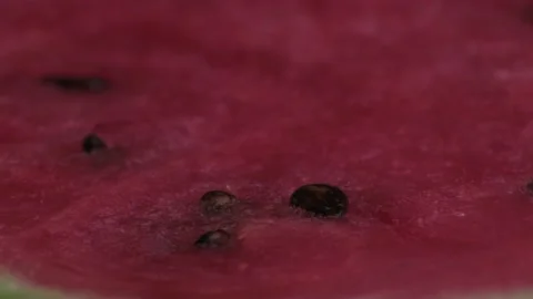 Macro shot of open watermelon rotates on the table Video stock 138328692