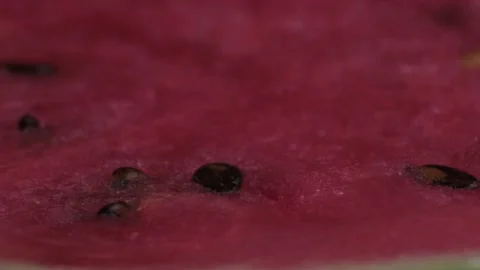 Macro shot of open watermelon rotates on the table Stock Footage 138328936