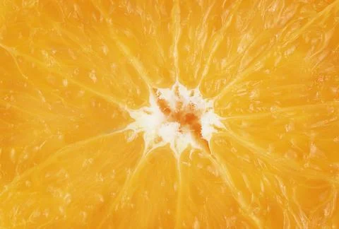 Macro shot of orange fruit texture. Food background Stock Photos