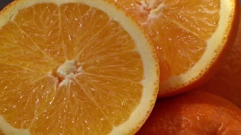 Macro shot of orange slices with moving sunlight and fresh citrus texture Stock Footage 330467004