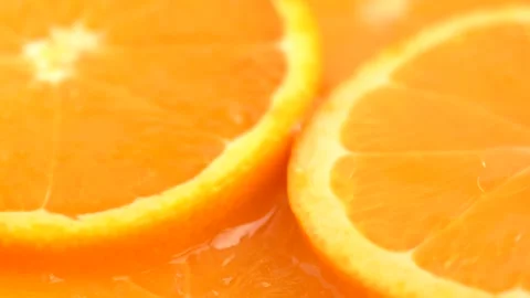 Macro shot of orange slices, rotate. Top view of fresh citrus orange. Healt.. Stock Footage 274554882
