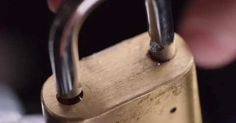 Macro shot of a padlock unlocking then locking again Stock Footage 71782277