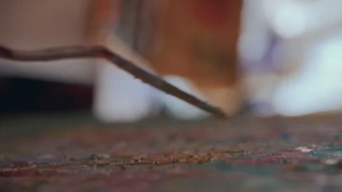 Macro Shot of Painter Using Palette Knife to Layer Oil Paint onto Canvas Stockbeeldmateriaal 330883447