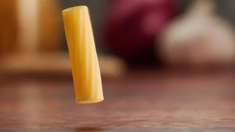 Macro shot of pasta falling and bouncing Stock Footage 156809331