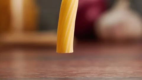 Macro shot of pasta falling and bouncing Stock Footage 156846031