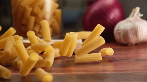 Macro shot of pasta falling over a table Stock Footage 156787298
