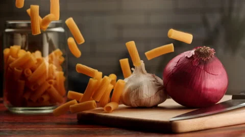 Macro shot of pasta falling over a table Stock Footage 156787998