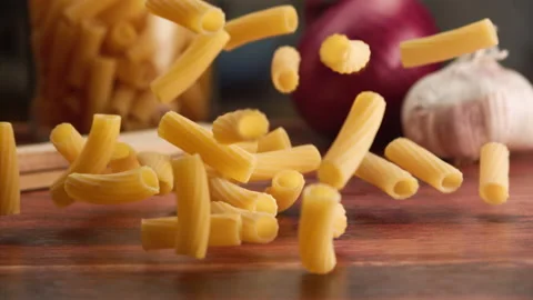 Macro shot of pasta falling over a table Stock Footage 156810344