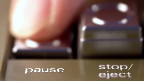 Macro shot of a pause button of a vintage tape recorder pressed by a finger Stock Footage 170607863