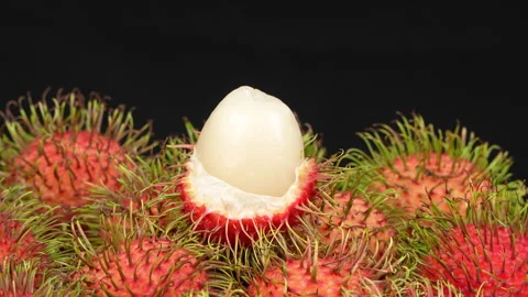 Macro Shot of Peeled Red Rambutan Fruit Showing White Juicy Flesh Stock Footage 336314941